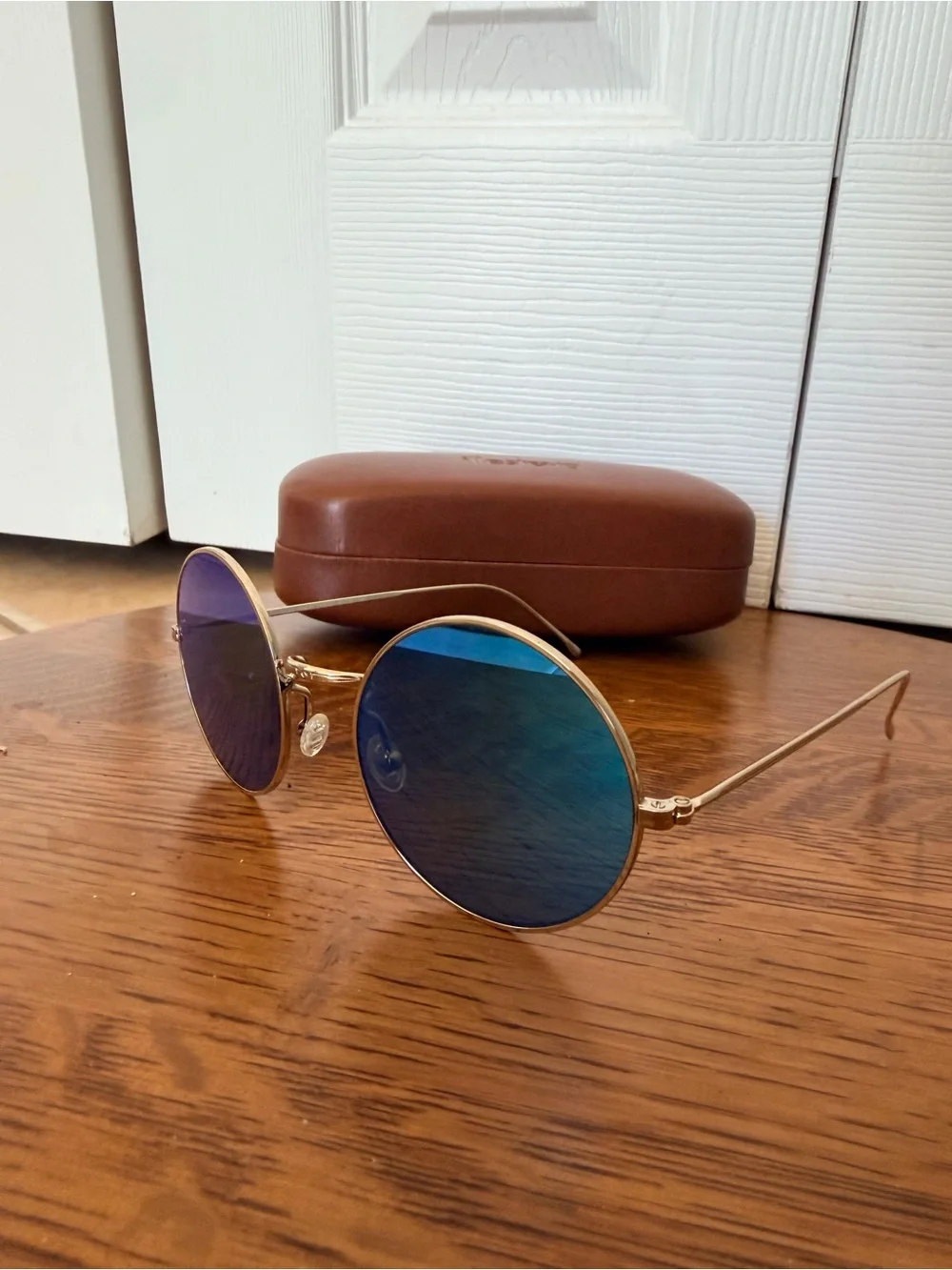 Illesteva Porto Cervo Round Silver Frame Sunglasses with Blue Mirrored Lenses